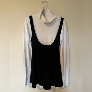 Cute oversized Longe sleeve white tee with below the breast cut black dress.